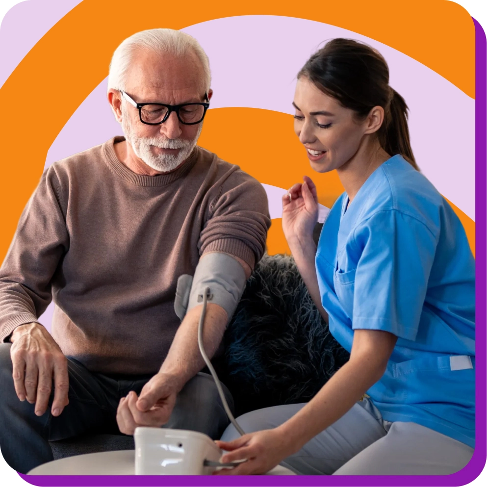 Elderly man getting blood pressure checked by a nurse at home against colorful background.