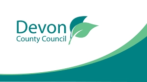 Devon County Council logo featuring green leaves on a white background with a green wave design at the bottom.